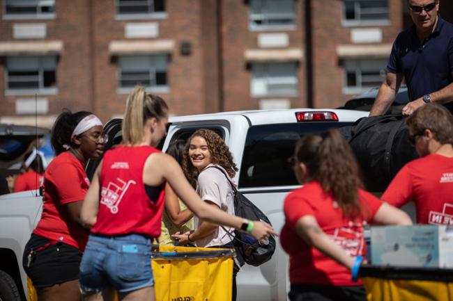 Students unpacking car during move-in weekend